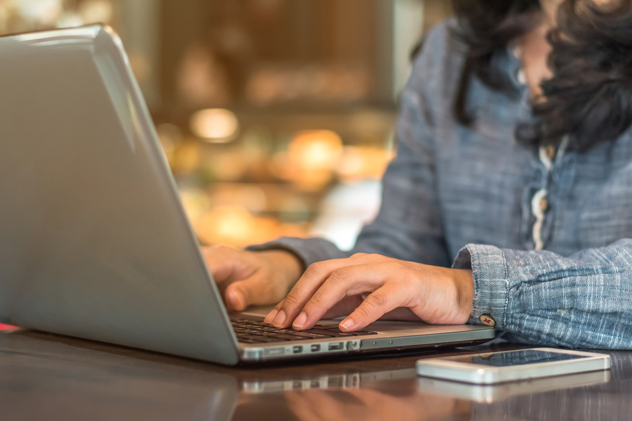 lady-hands-and-arms-using-laptop