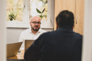 Chris Annis, CCO at Affinia in a accountancy client meeting. Affinia client focused photography. Accountancy & Advisory service page.