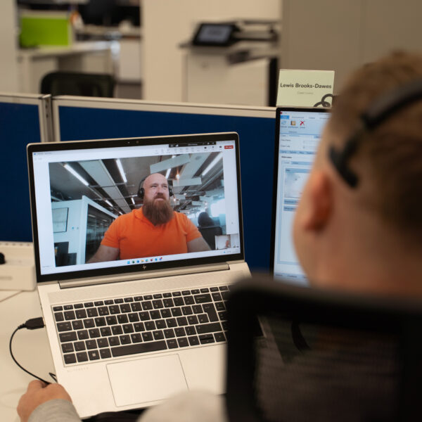 two males on a virtual call at work