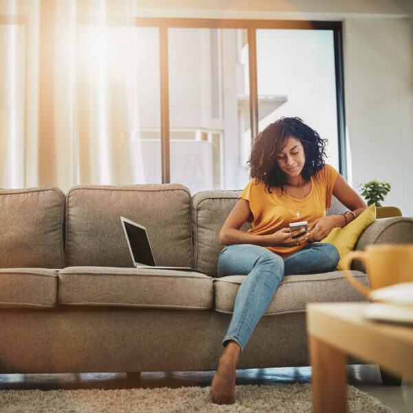 lady on sofa looking at phone