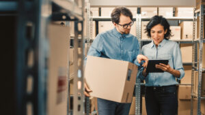 Man and woman looking at device
