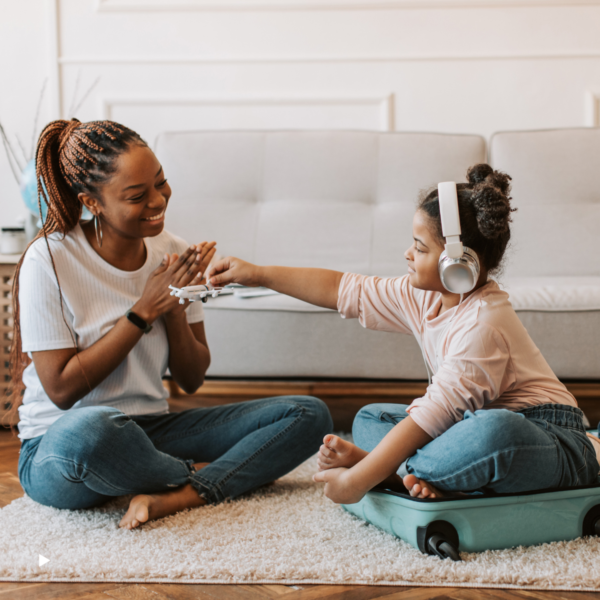 Mother and daughter packing for holiday